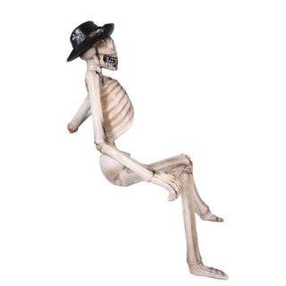 SKELETON SITTING ON A BENCH